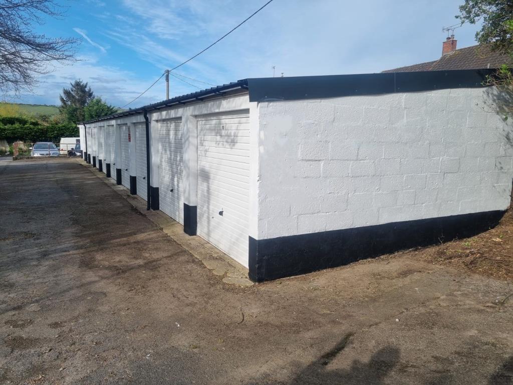 Lot: 114 - TEN REFURBISHED LOCK-UP GARAGES - General view of all garages rear of 66 Pitman Place